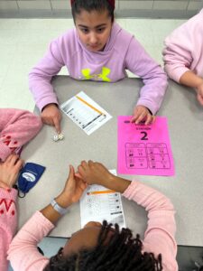 student playing math dice