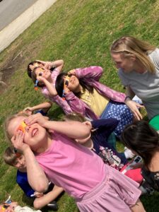 Students look at the eclipse