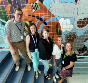 4th grade team poses on the stairs