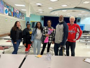 Sicili McCoy with extended day staff after receiving Glebe Support Employee of the Year