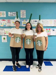 5th grade team shows off their Starbucks coffee costumes